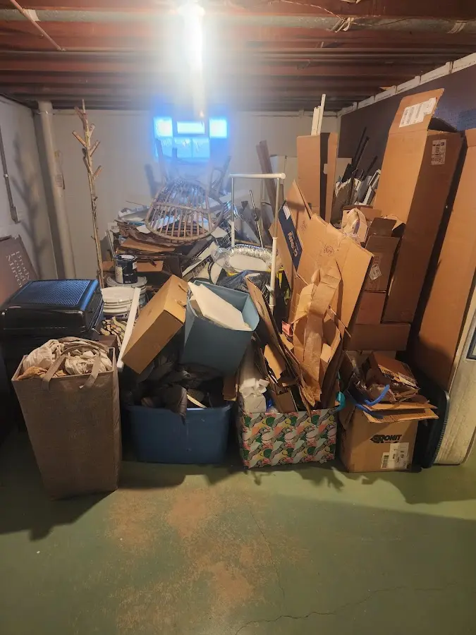 Roll-off dumpster container at job site for 2 Yard Dumpster Rental in Richwood